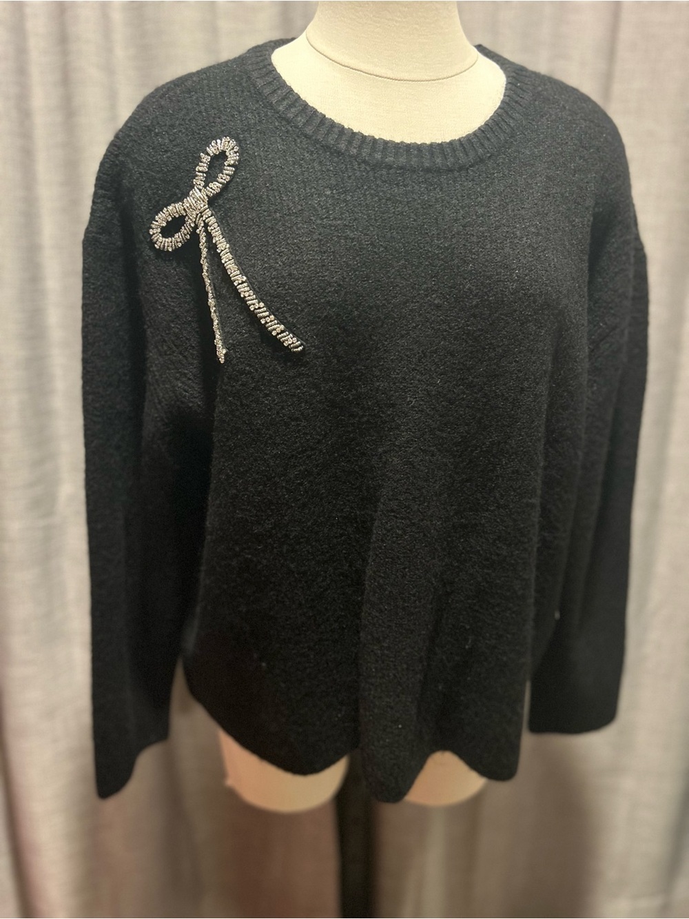 CeCe Black Crewneck Sweater with Crystal Bow Accent